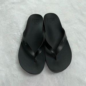 Reef black flip flops